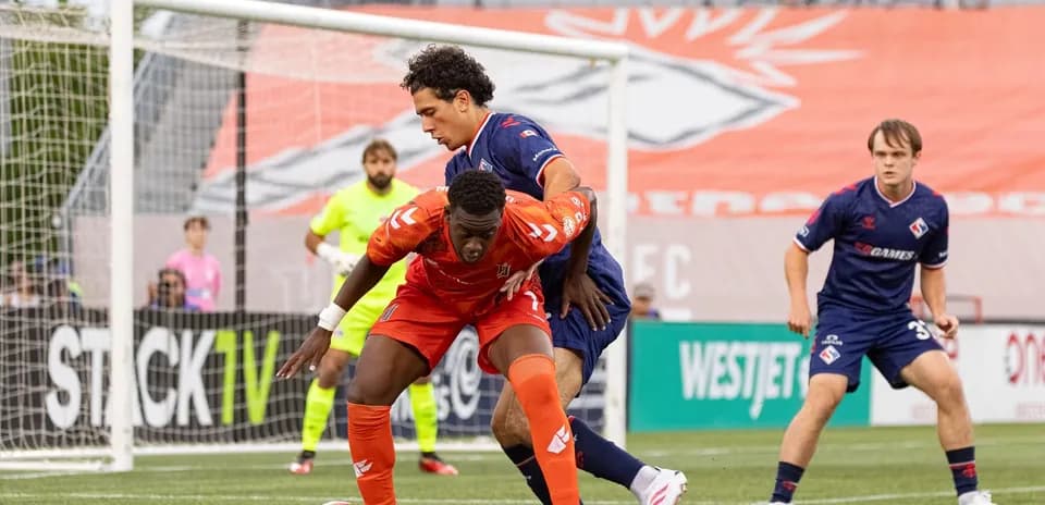 Players competing for the ball in match