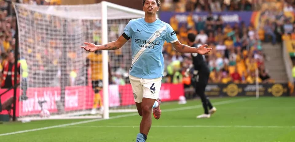 Player celebrating after scoring a goal for Manchester City