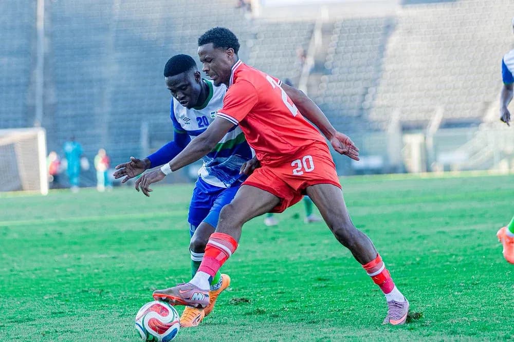 Two players contesting for the ball during match