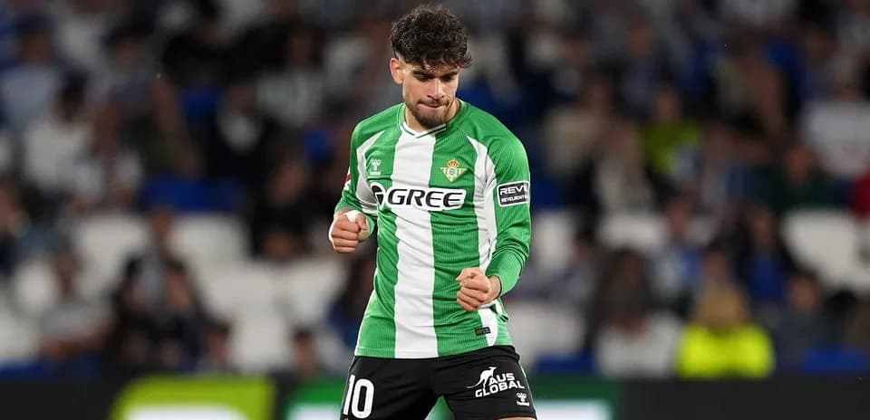 Player celebrating in Real Betis green jersey