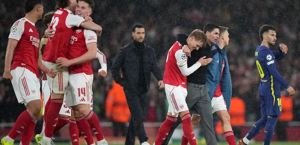 Arsenal players celebrating after UEFA match