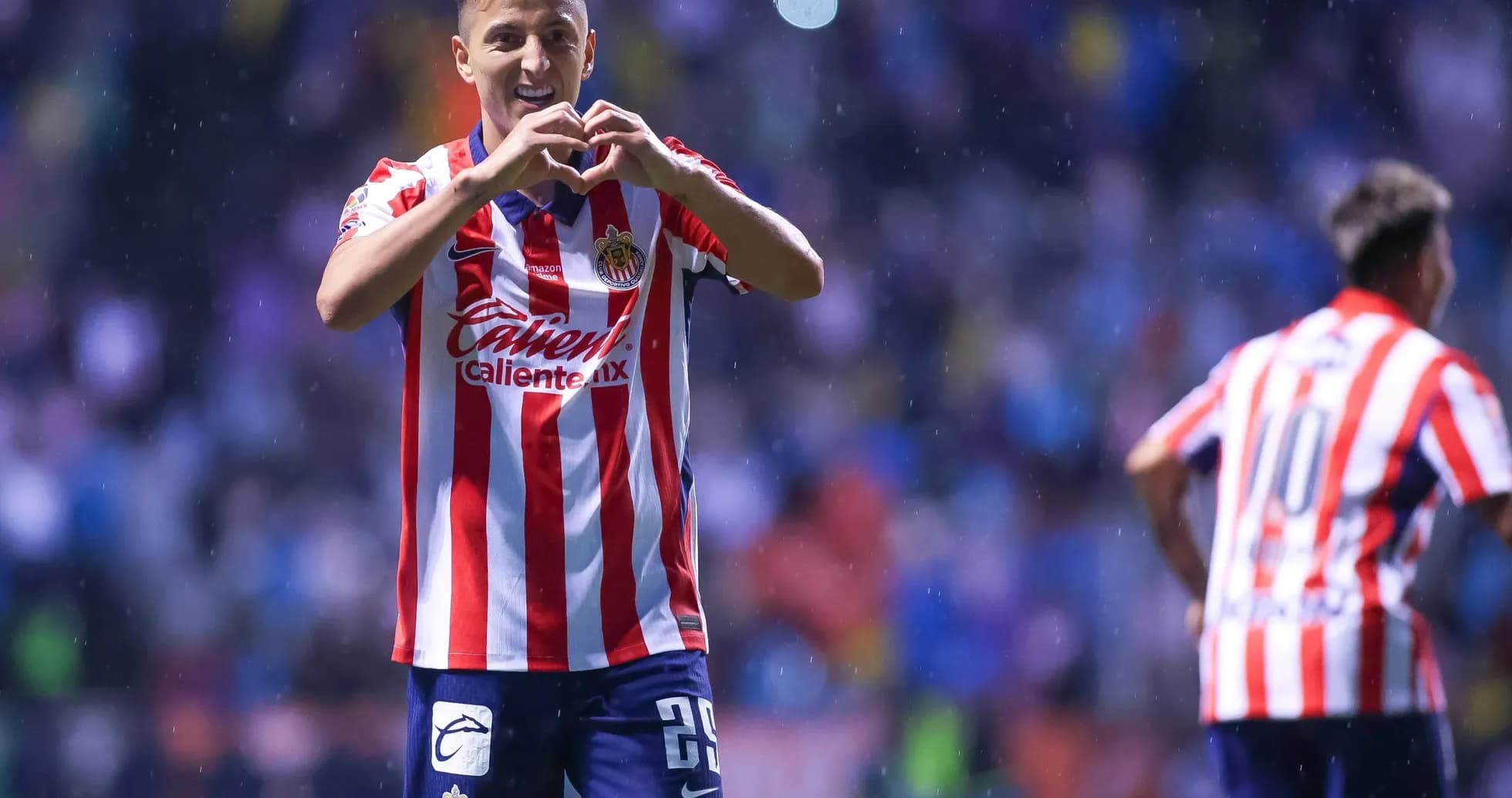 Chivas player celebrating a goal in Liga MX