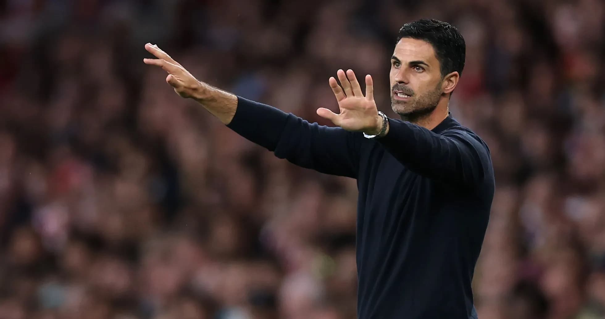 Manager gesturing during match from the sideline