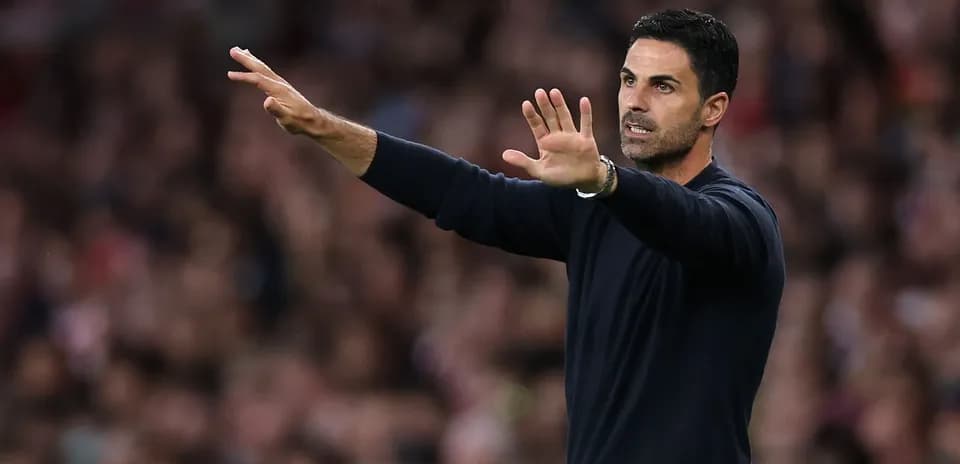 Manager gesturing during match from the sideline