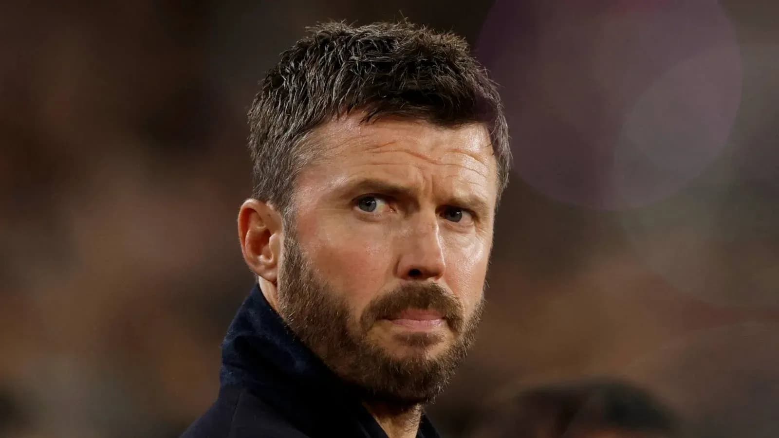 Coach looking on during a match