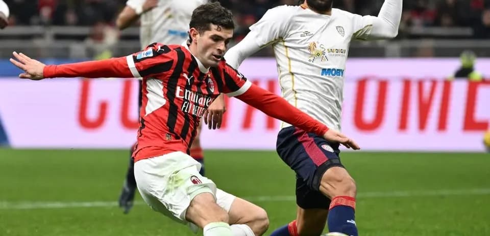 AC Milan player challenges Cagliari opponent during match