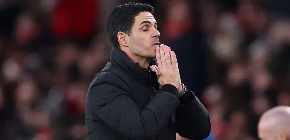 Manager gesturing during a match on the sideline
