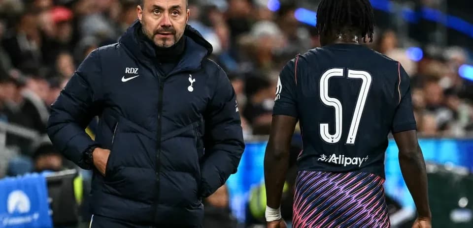 Tottenham manager interacting with player during match