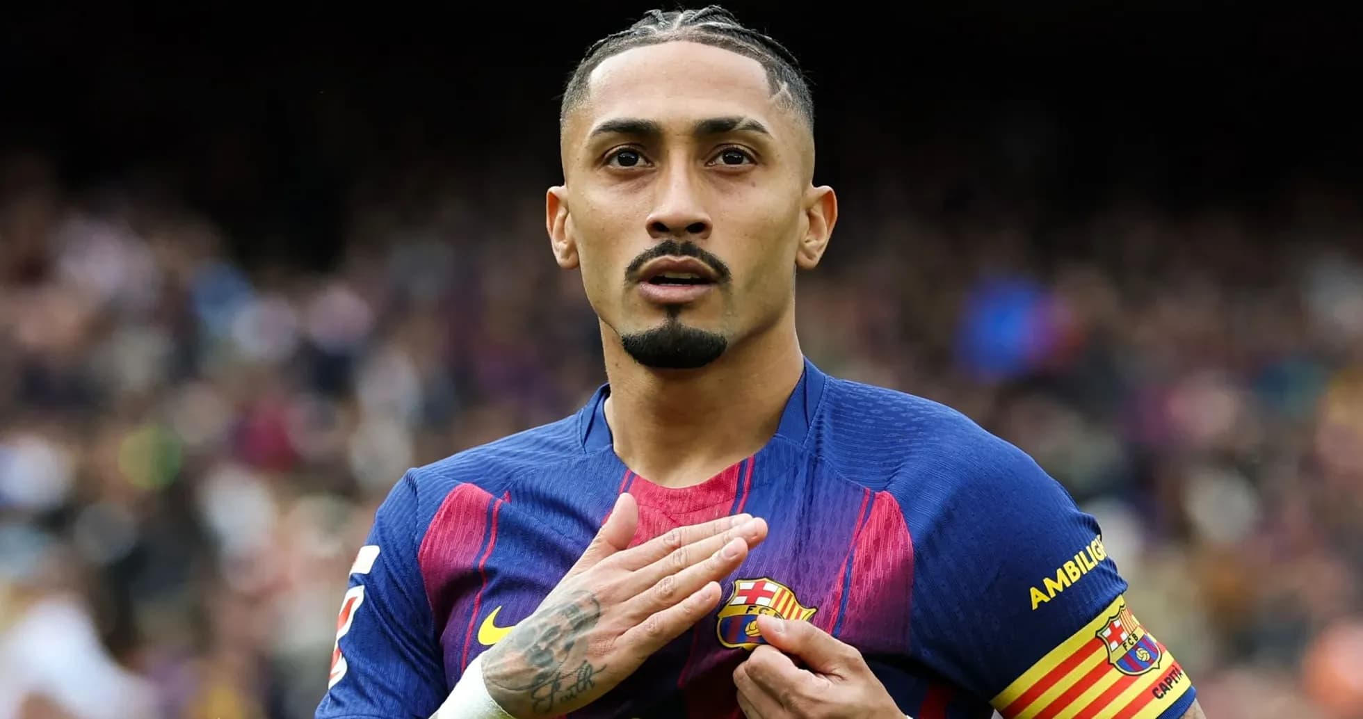 Player gesturing while wearing FC Barcelona jersey