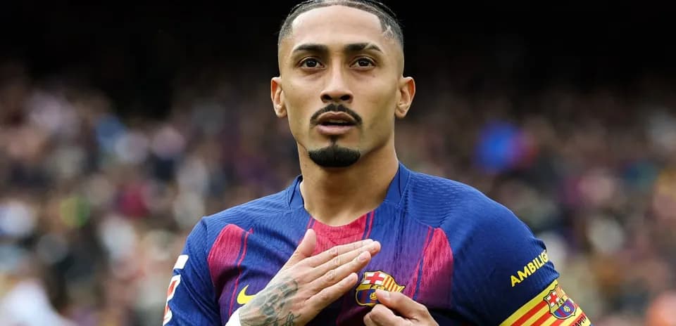 Player gesturing while wearing FC Barcelona jersey