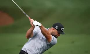 Golfer executing a swing on the course