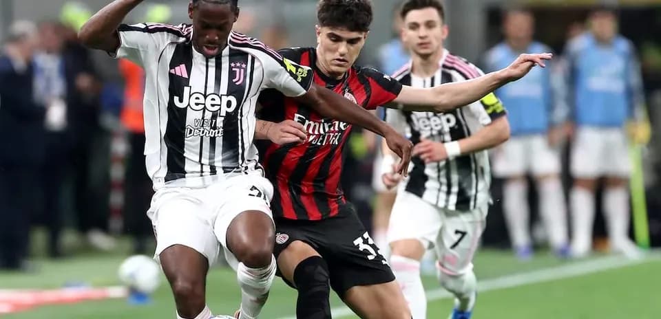 Two players competing for the ball during match