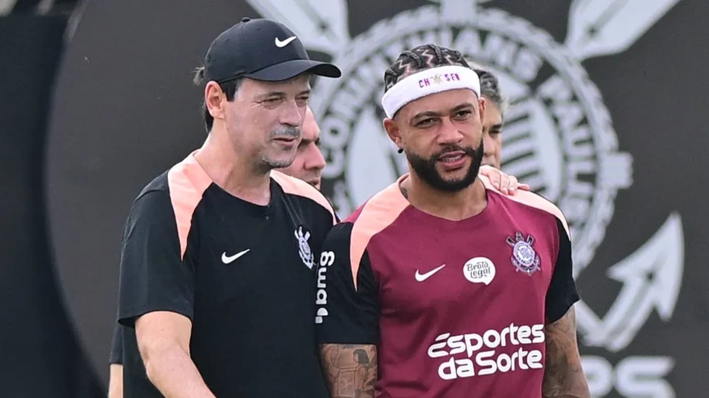 Coach and player discussing during training session