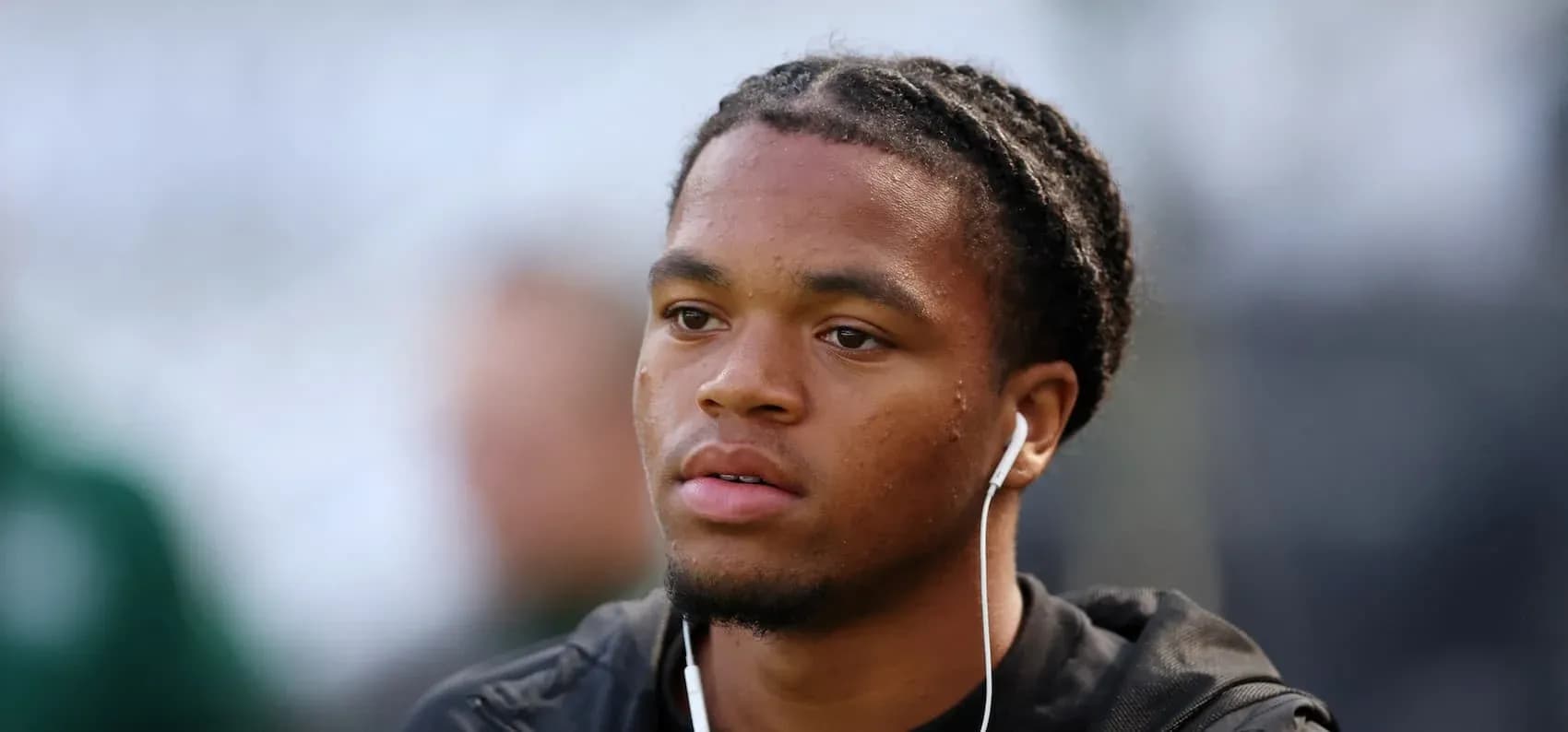 Player wearing earphones before a match