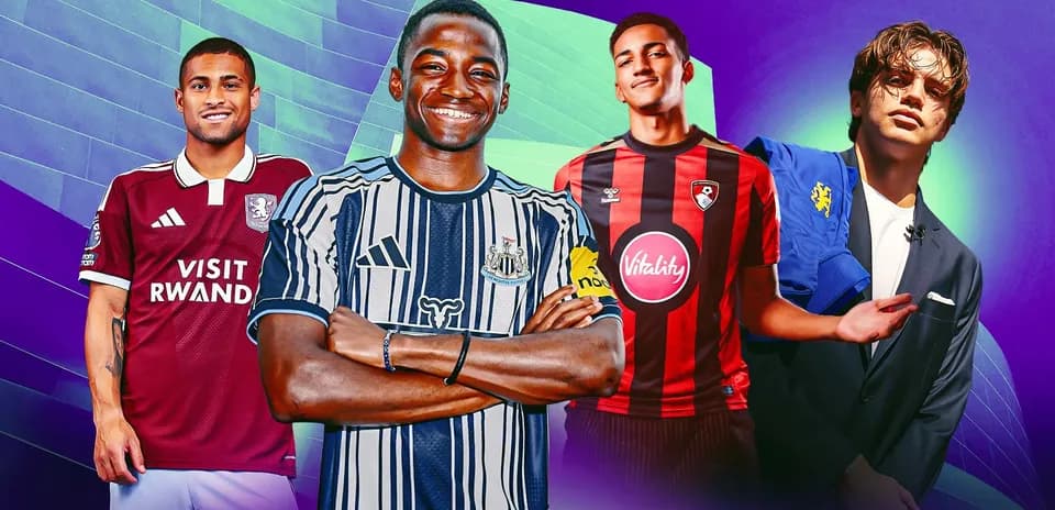 Four football players in team kits posing together