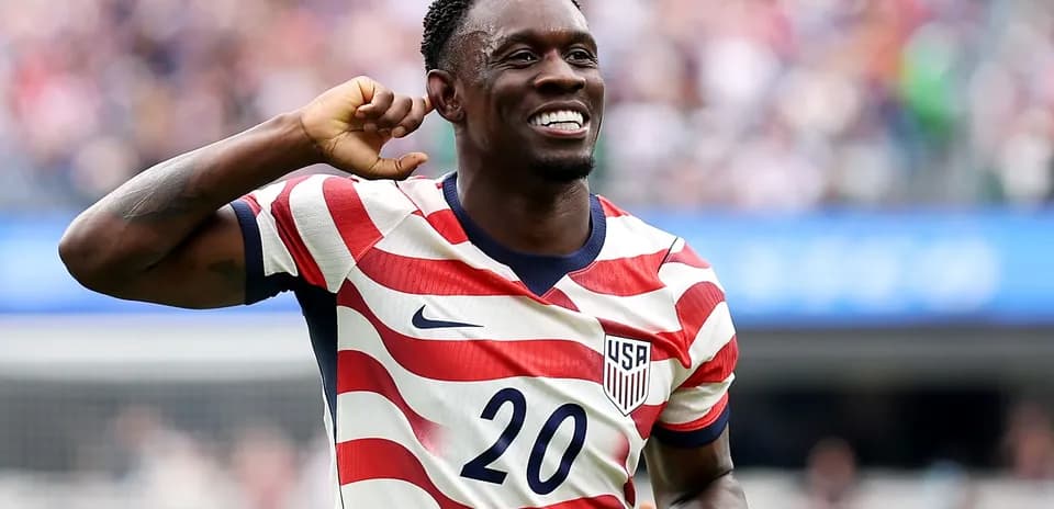 Player celebrating a goal in USA jersey