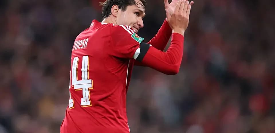 Player applauding fans during match celebration