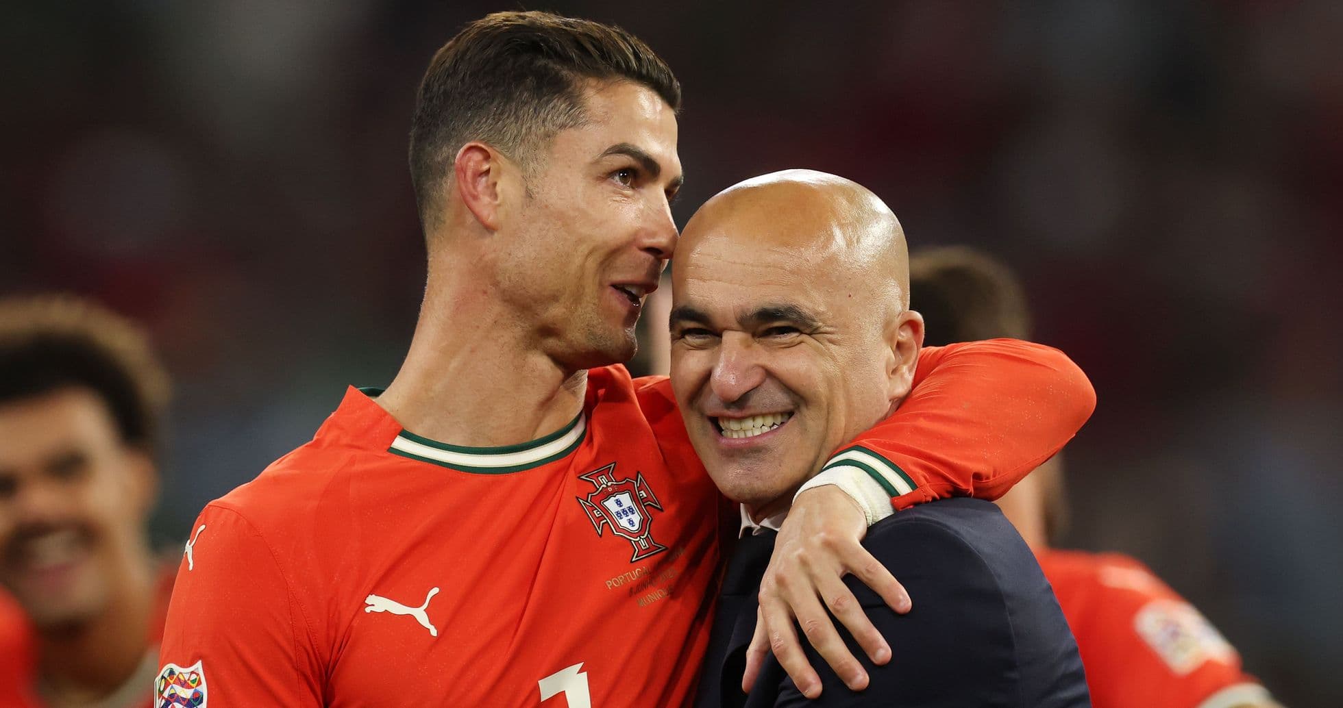Cristiano Ronaldo and coach celebrating victory together