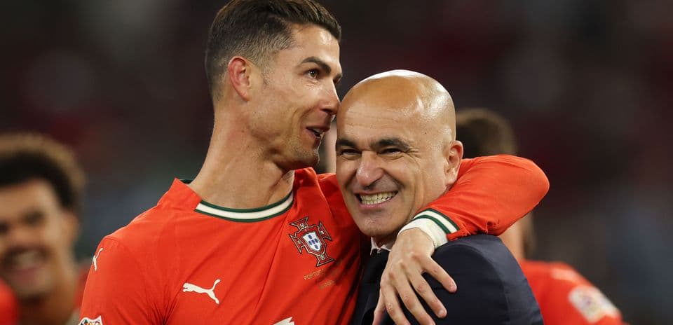 Cristiano Ronaldo and coach celebrating victory together