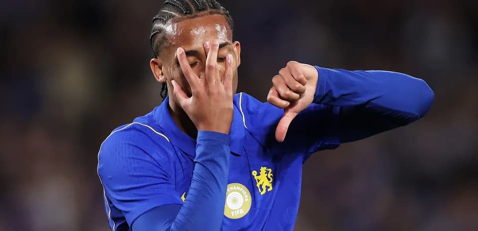 Player in blue jersey making a gesture during match