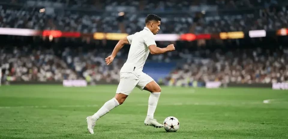 Player running with ball during football match