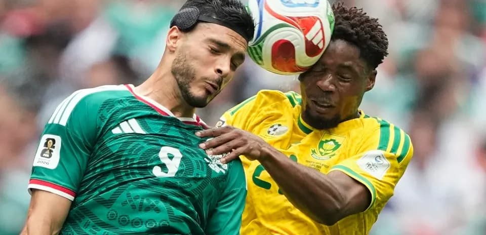 Players from Mexico and South Africa contesting the ball