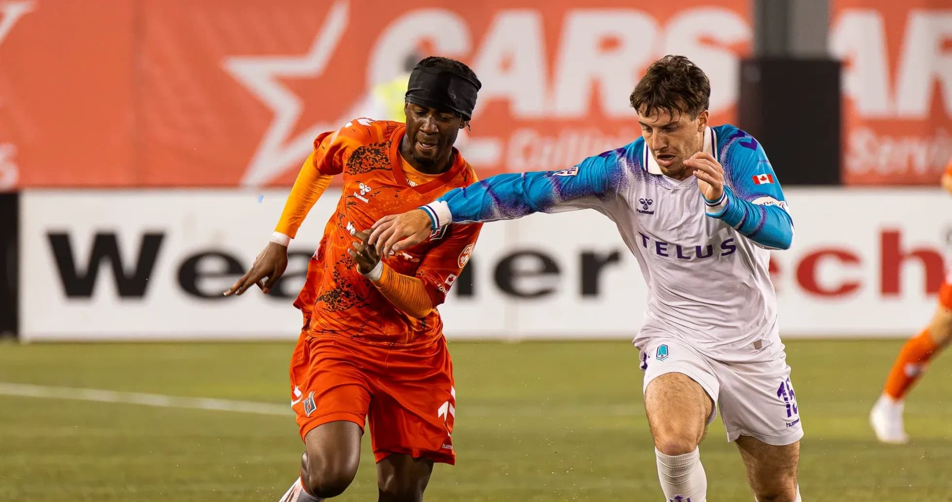 Players competing for the ball in match