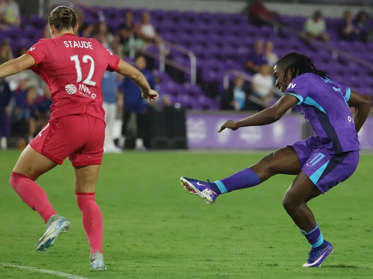 Two players competing for the ball in match