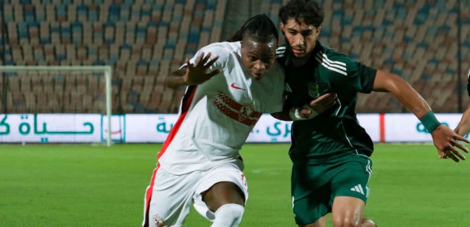 Two players competing for the ball during match