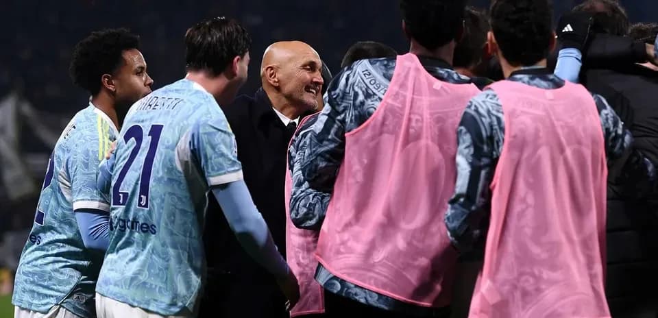 Team celebrating with coach after match victory