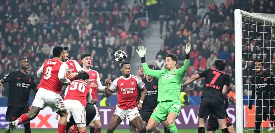 Players contesting a corner kick during match