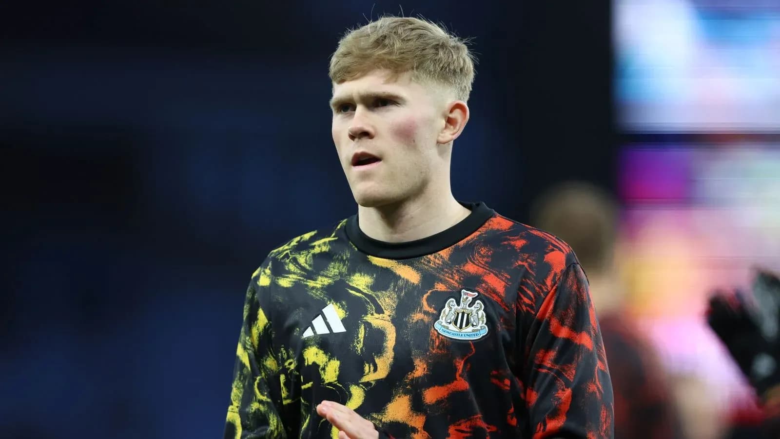 Goalkeeper in colorful warm-up shirt before match