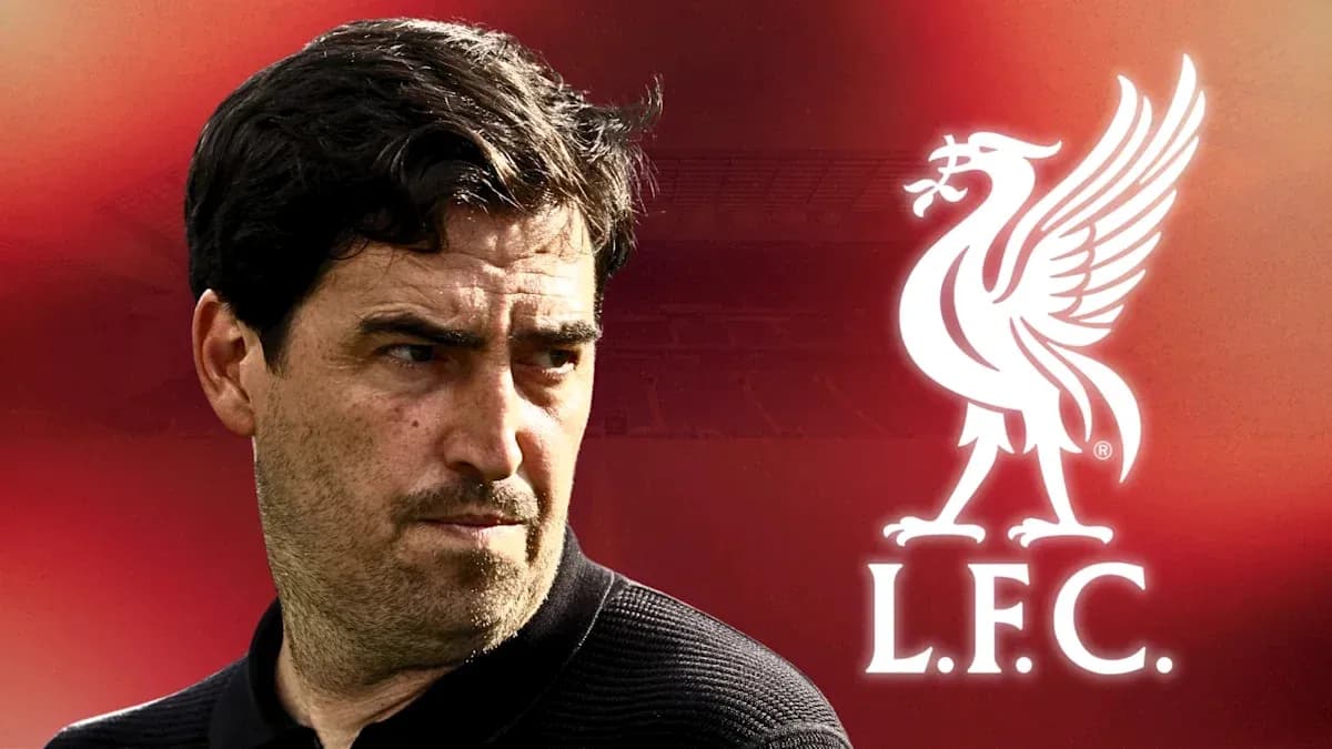 Coach with Liverpool FC logo in background