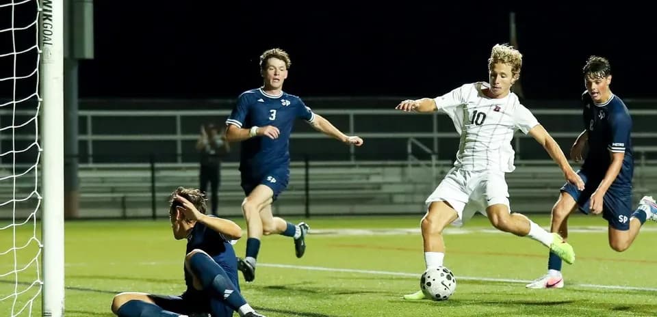 Player attempting to score near the goal line