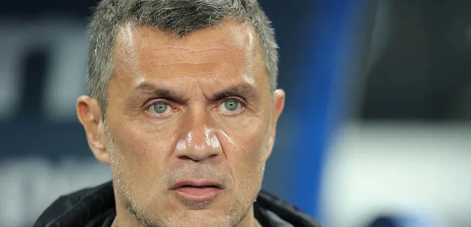 Coach focused during match on the sidelines