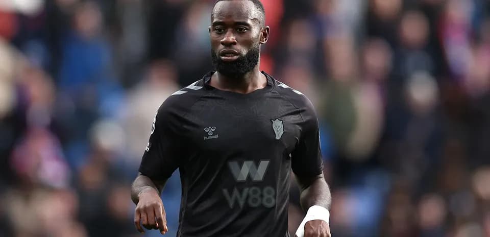 Player in black jersey during match on field