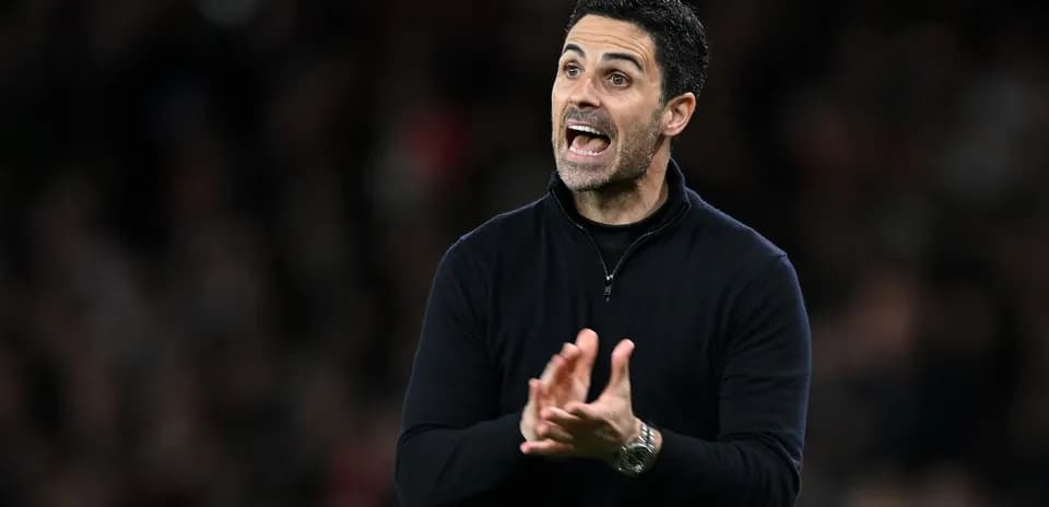 Manager gesturing during a football match