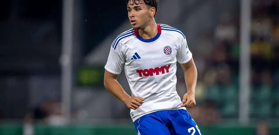 Player in white and blue kit during match