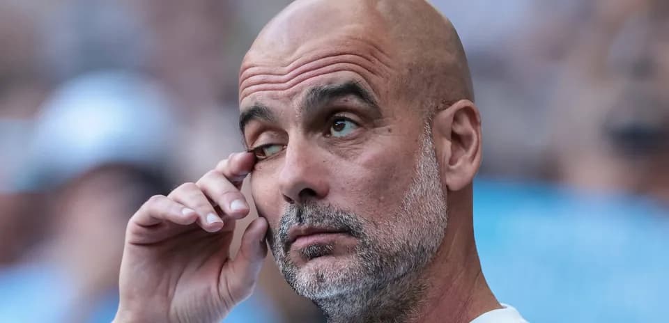 Coach with hand on face during match observation