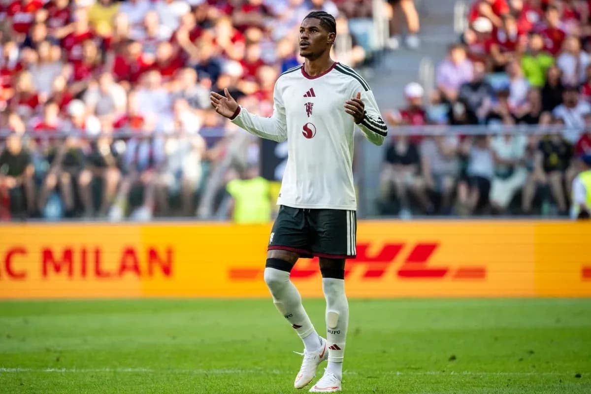 Player gesturing during match with fans in background