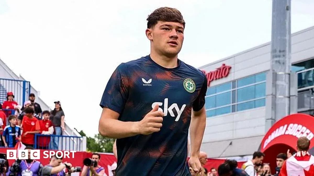 Player jogging onto the field before the match