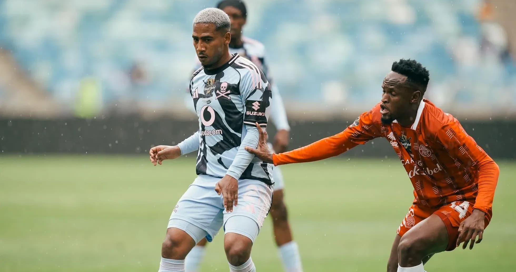 Player dribbling while being challenged by opponent