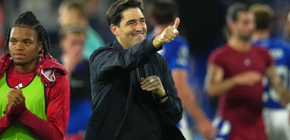Coach giving thumbs up after match victory