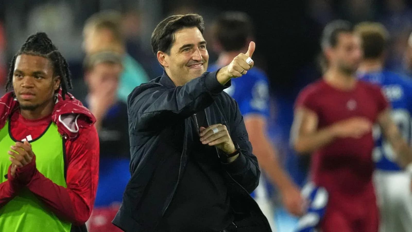 Coach giving thumbs up after match victory