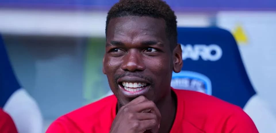 Player smiling while sitting on bench during match