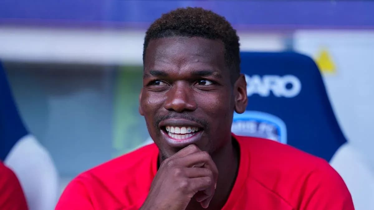 Player smiling while sitting on bench during match