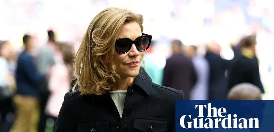 Woman in sunglasses at a sporting event