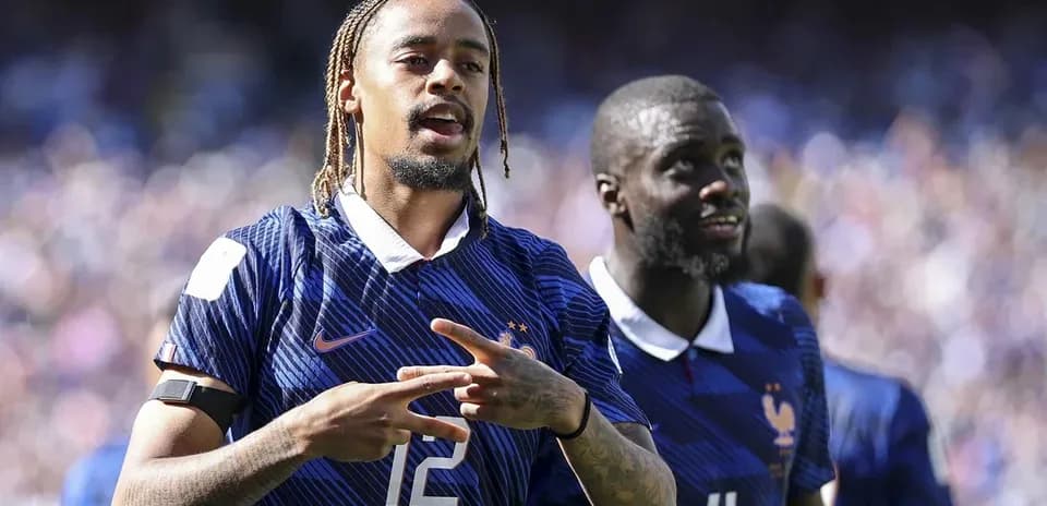 Two France players celebrating on the field
