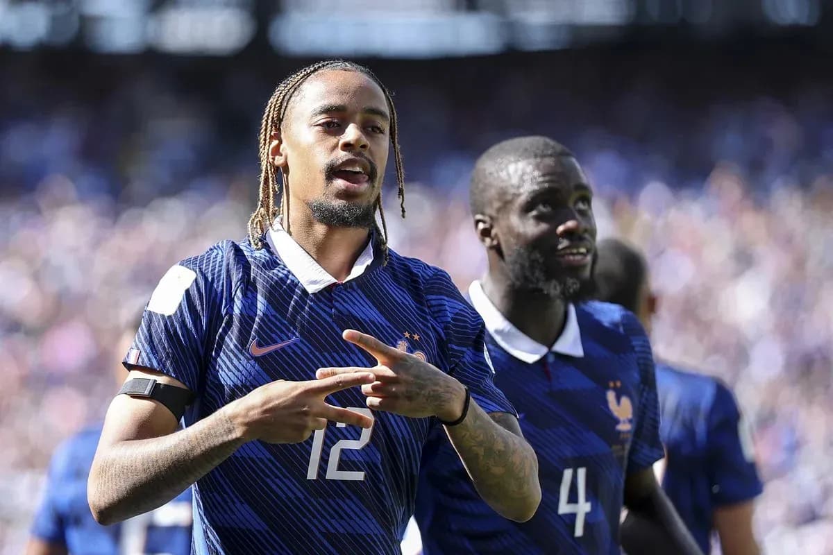 Two France players celebrating on the field