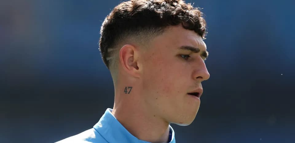 Player with short hair and tattoo on neck